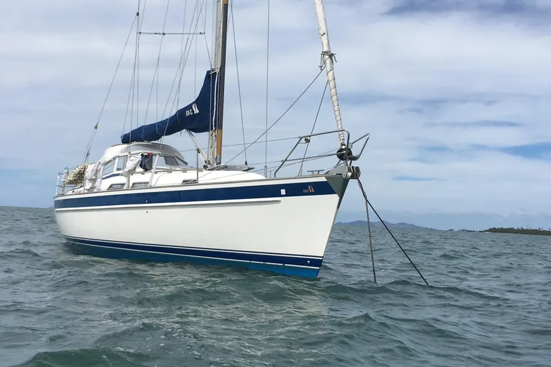 Ceres Yacht Photos Pics 2016 Hallberg-Rassy 342 sailboat anchored on calm sea under a cloudy sky.