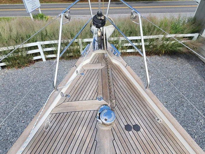 Ceres Yacht Photos Pics Bow of 2016 Hallberg-Rassy 342 sailboat with teak decking and anchor chain.