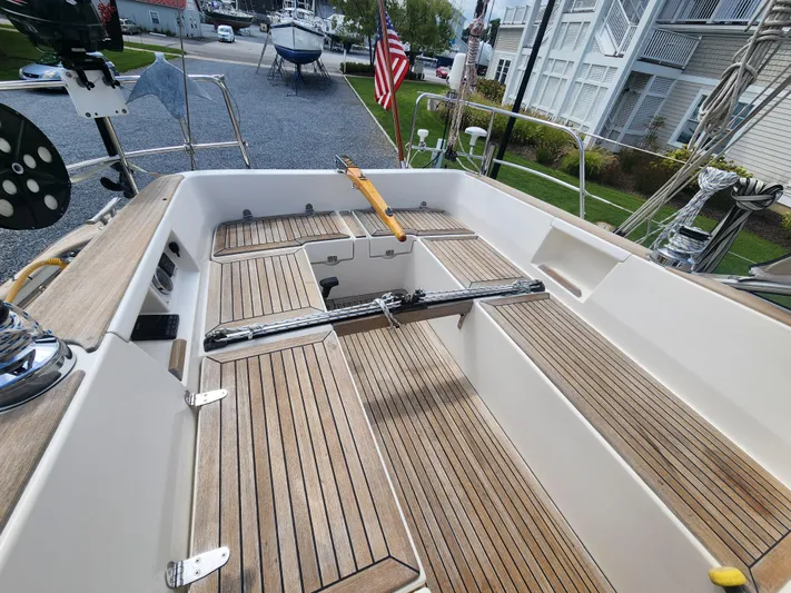 Ceres Yacht Photos Pics Hallberg-Rassy 342 sailboat cockpit with teak flooring, 2016 model, docked near residential area.