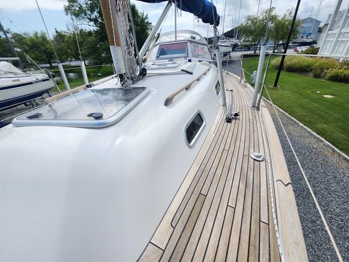 Ceres Yacht Photos Pics 2016 Hallberg-Rassy 342 sailboat with teak deck, docked in a marina.