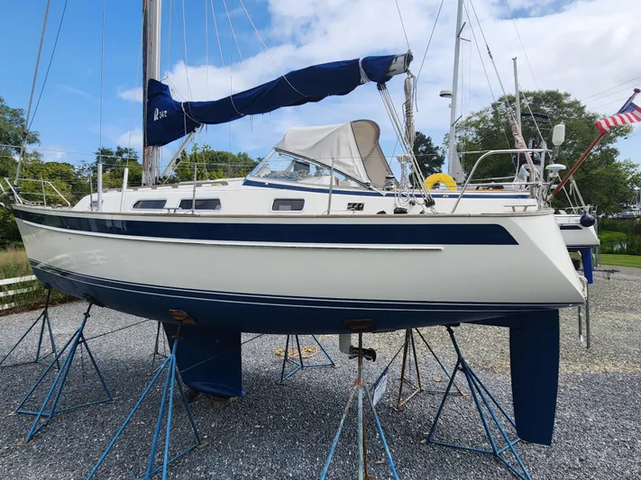 Ceres Yacht Photos Pics 2016 Hallberg-Rassy 342 sailboat on stands, blue and white hull, outdoor setting.
