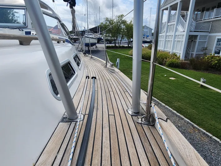 Ceres Yacht Photos Pics Deck view of 2016 Hallberg-Rassy 342 sailboat, showcasing teak wood and marina background.