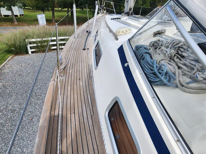 Ceres Yacht Photos Pics 2016 Hallberg-Rassy 342 sailboat deck with coiled ropes and wooden finish.