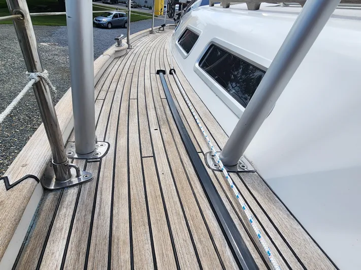 Ceres Yacht Photos Pics Teak deck of 2016 Hallberg-Rassy 342 sailboat, showcasing sleek design and craftsmanship.