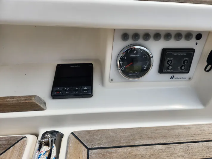 Ceres Yacht Photos Pics Control panel of a 2016 Hallberg-Rassy 342 sailboat with navigation instruments.