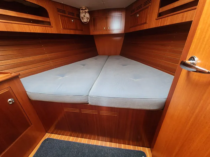 Ceres Yacht Photos Pics Cozy cabin interior of 2016 Hallberg-Rassy 342 yacht with wooden finish and comfortable bedding.