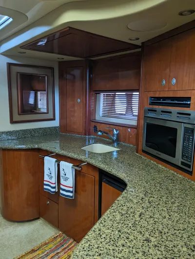  Yacht Photos Pics 2006 Sea Ray 44 Sundancer kitchen with granite countertops and modern appliances.