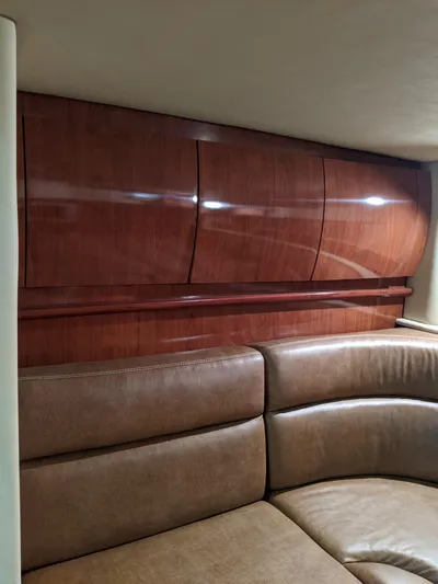  Yacht Photos Pics Interior of 2006 Sea Ray 44 Sundancer with wood paneling and leather seating.