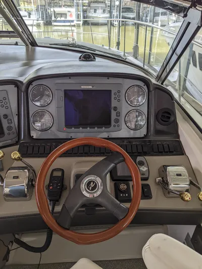  Yacht Photos Pics Helm of 2006 Sea Ray 44 Sundancer with navigation controls and steering wheel.
