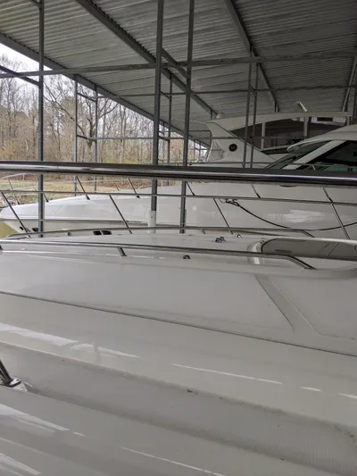  Yacht Photos Pics 2006 Sea Ray 44 Sundancer yacht docked under a covered marina.