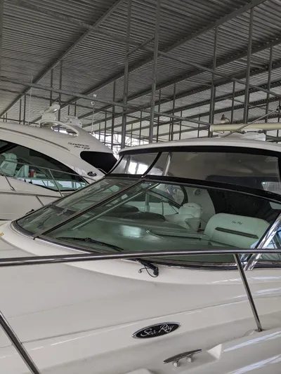  Yacht Photos Pics 2006 Sea Ray 44 Sundancer yacht docked in a covered marina.