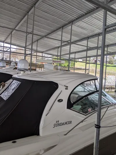  Yacht Photos Pics 2006 Sea Ray 44 Sundancer yacht docked under a covered marina.