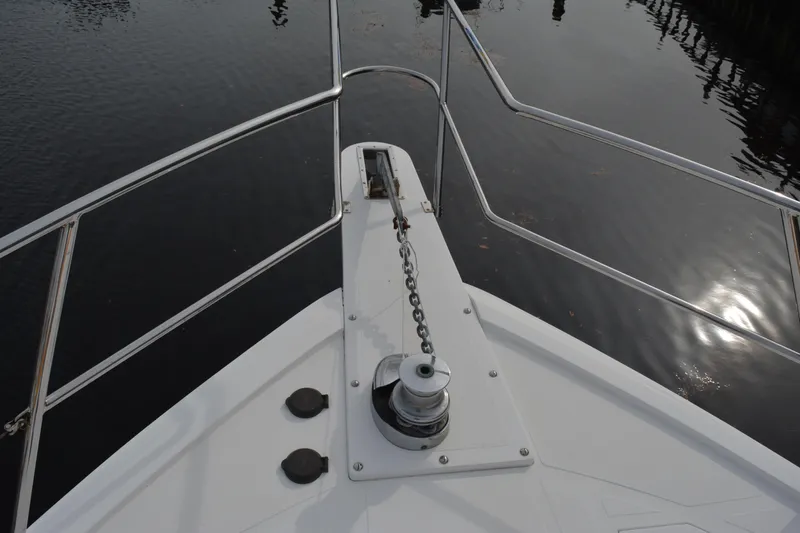Wandra Yacht Photos Pics Bow of 2008 Novatec Islander 60 yacht with anchor chain and railing.