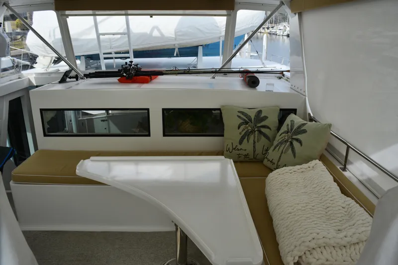 Wandra Yacht Photos Pics Cozy seating area on 2008 Novatec Islander 60 yacht with cushions and blanket.