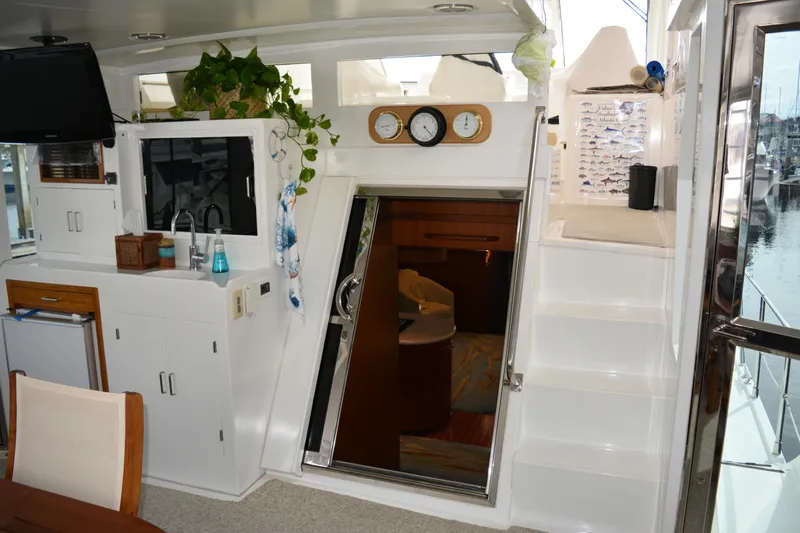 Wandra Yacht Photos Pics Interior of 2008 Novatec Islander 60 yacht with kitchenette and stairs.