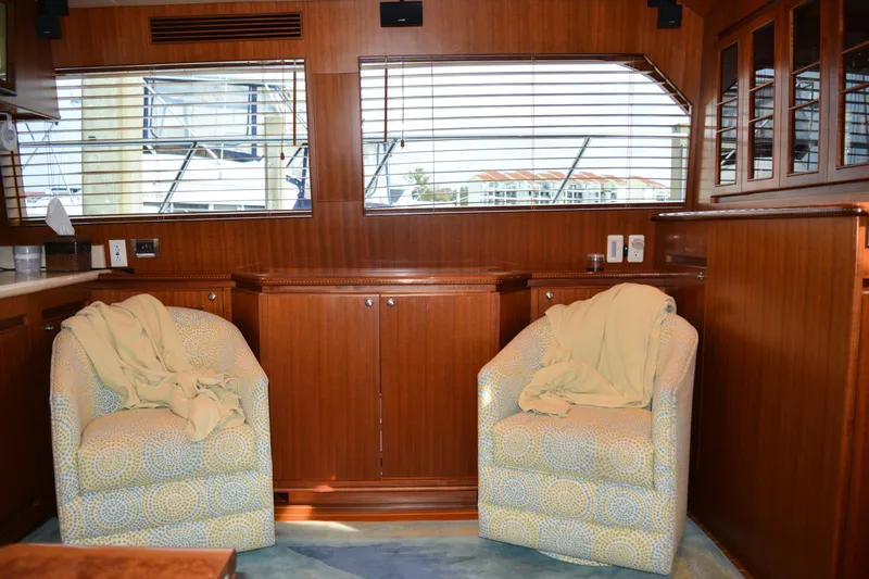 Wandra Yacht Photos Pics Interior of 2008 Novatec Islander 60 yacht with cozy seating and wooden cabinetry.