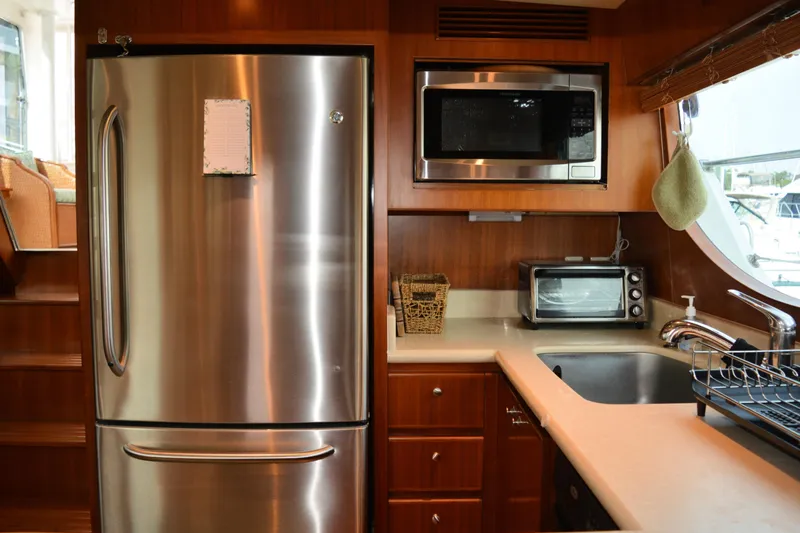 Wandra Yacht Photos Pics Luxurious kitchen in 2008 Novatec Islander 60 yacht with stainless steel appliances.