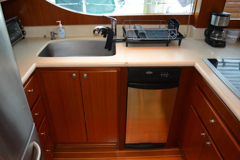 Wandra Yacht Photos Pics Kitchen area of 2008 Novatec Islander 60 yacht with sink, dishwasher, and coffee maker.