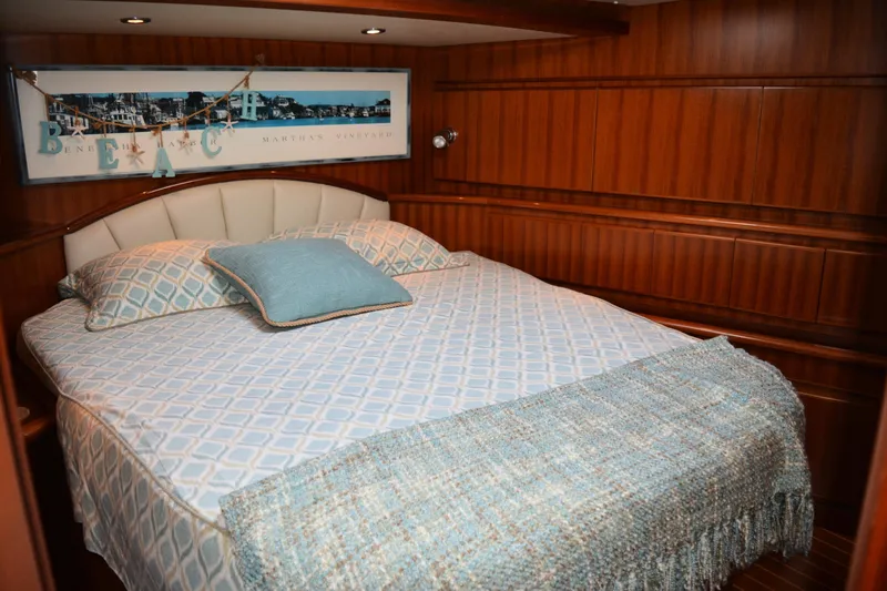 Wandra Yacht Photos Pics Luxurious bedroom interior on 2008 Novatec Islander 60 yacht with elegant wood paneling.