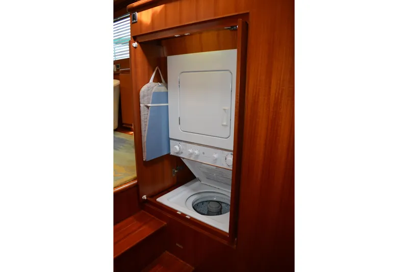 Wandra Yacht Photos Pics Laundry area with stacked washer-dryer in 2008 Novatec Islander 60 yacht.
