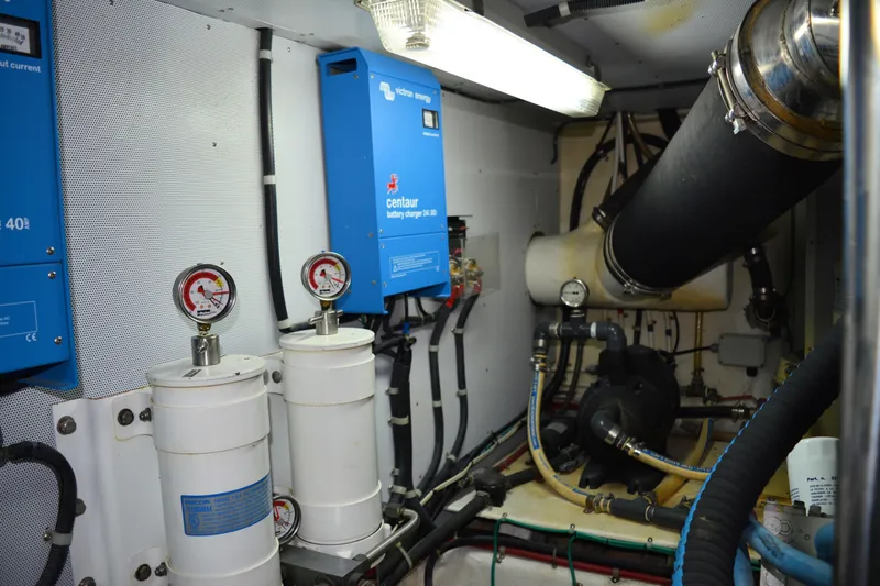 Wandra Yacht Photos Pics Engine room of 2008 Novatec Islander 60 with battery chargers and gauges.