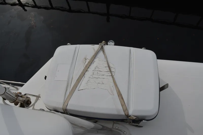 Wandra Yacht Photos Pics Weathered cooler on 2008 Novatec Islander 60 yacht deck, secured with straps.