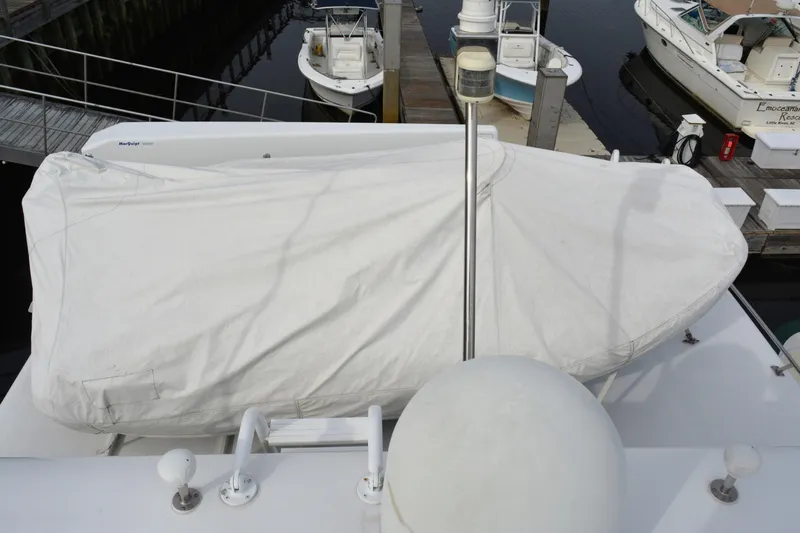 Wandra Yacht Photos Pics Covered boat on a 2008 Novatec Islander 60 yacht at a marina dock.