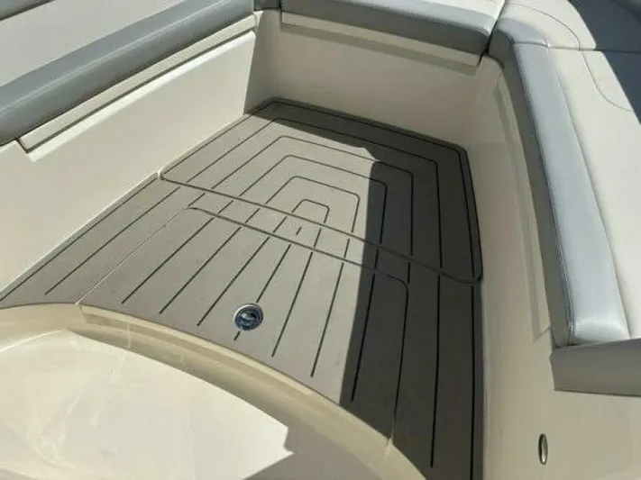  Yacht Photos Pics 2023 Scout 377 LXF boat interior with cushioned seating and non-slip flooring.