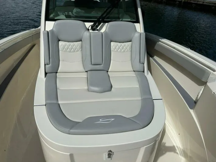  Yacht Photos Pics 2023 Scout 377 LXF boat with luxurious gray seating on deck.