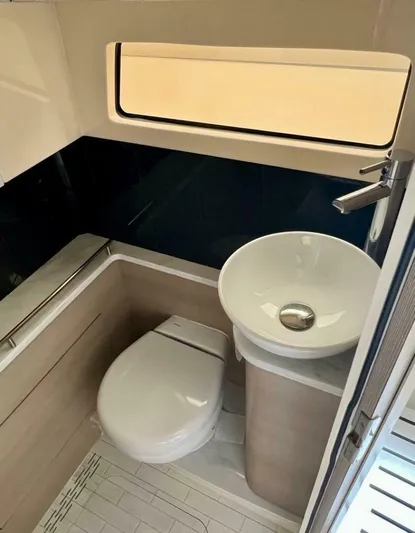  Yacht Photos Pics 2023 Scout 377 LXF boat bathroom with modern sink and toilet.