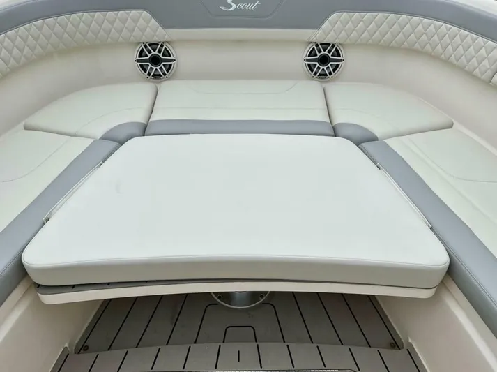  Yacht Photos Pics 2023 Scout 377 LXF boat interior with cushioned seating and speakers.