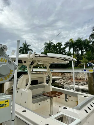  Yacht Photos Pics 2023 Scout 377 LXF boat docked, featuring sleek design and modern amenities.