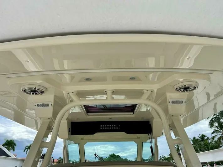  Yacht Photos Pics 2023 Scout 377 LXF boat interior with speakers and sleek design.