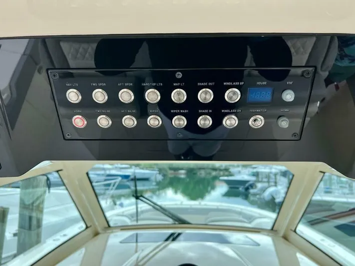  Yacht Photos Pics Control panel of 2023 Scout 377 LXF boat, featuring various switches and buttons.