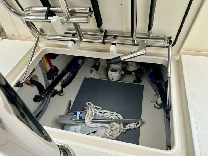  Yacht Photos Pics 2023 Scout 377 LXF boat storage compartment with ropes and equipment.