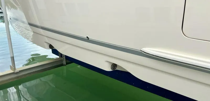  Yacht Photos Pics 2023 Scout 377 LXF boat hull detail above green water.