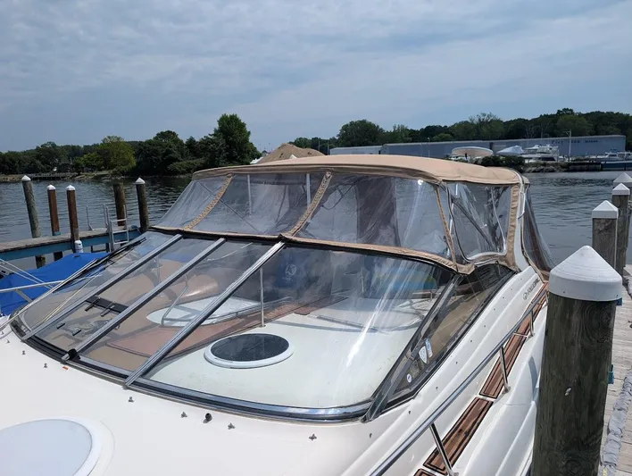No Drama Yacht Photos Pics 2002 Regal Commodore 3860 yacht docked by a serene waterfront.