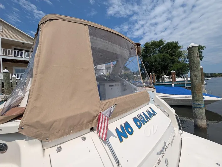 No Drama Yacht Photos Pics 2002 Regal Commodore 3860 boat docked, featuring tan canopy and "No Drama" text.