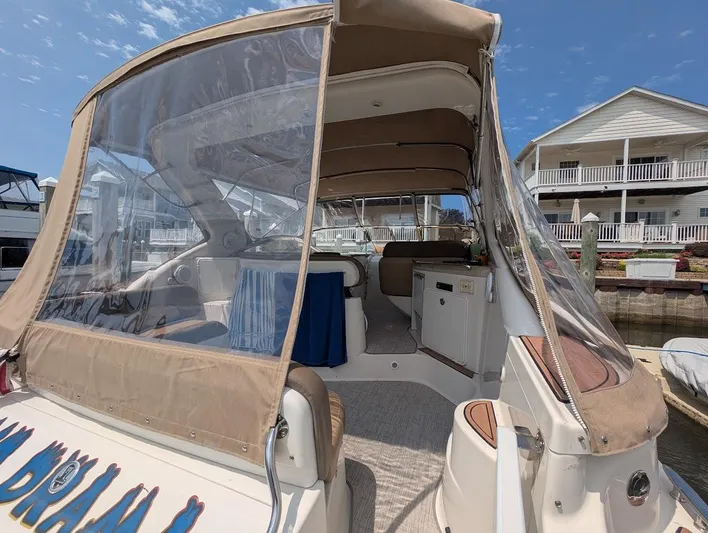 No Drama Yacht Photos Pics 2002 Regal Commodore 3860 yacht with covered seating area at a marina.