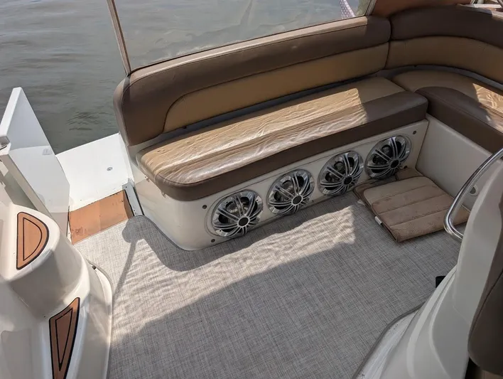 No Drama Yacht Photos Pics Interior of 2002 Regal Commodore 3860 boat with brown seating and built-in speakers.