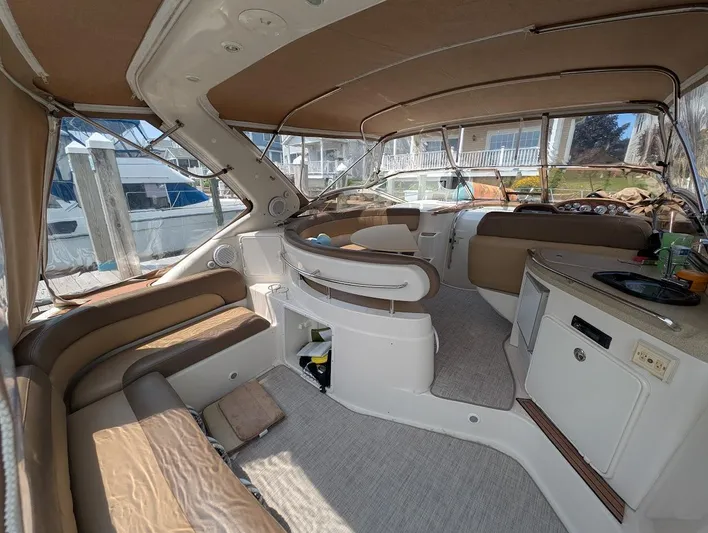 No Drama Yacht Photos Pics Interior of 2002 Regal Commodore 3860 yacht with beige seating and helm station.