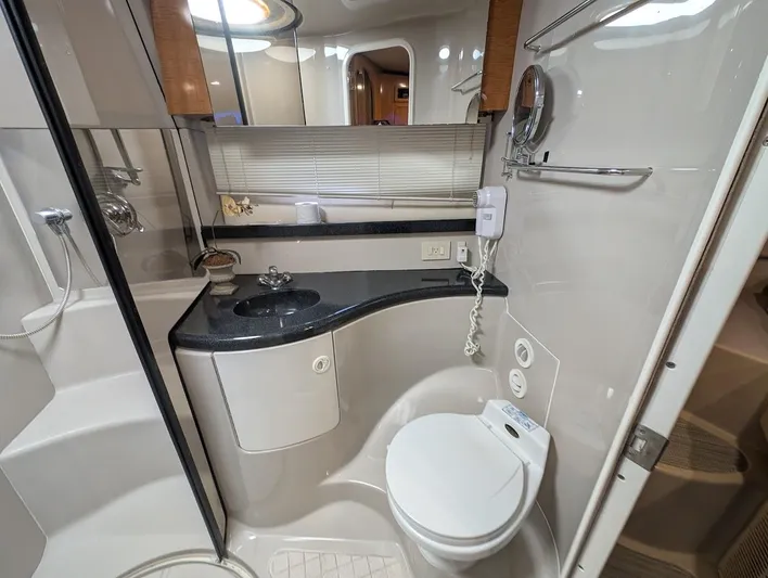 No Drama Yacht Photos Pics Luxurious bathroom in 2002 Regal Commodore 3860 yacht with modern fixtures and sleek design.