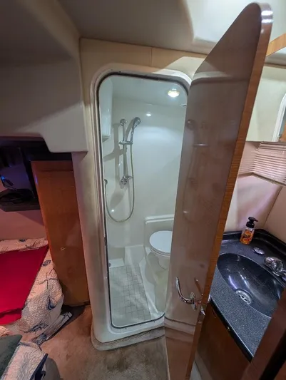 No Drama Yacht Photos Pics Interior of 2002 Regal Commodore 3860 yacht showing compact bathroom with shower and sink.