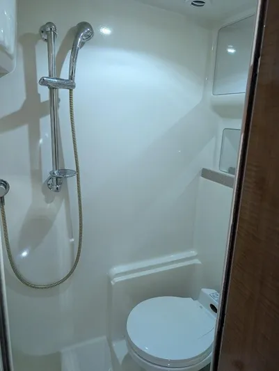 No Drama Yacht Photos Pics Bathroom interior of 2002 Regal Commodore 3860 yacht with shower and toilet.