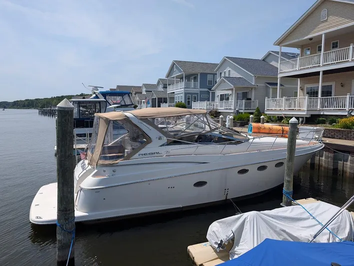 No Drama Yacht Photos Pics 2002 Regal Commodore 3860 yacht docked near waterfront homes.