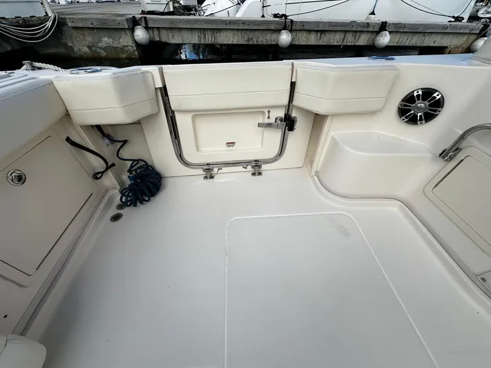  Yacht Photos Pics 2021 Grady-White Express 370 boat deck with storage compartments and speaker.