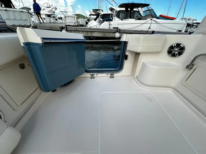  Yacht Photos Pics 2021 Grady-White Express 370 boat interior with seating and storage, docked at marina.