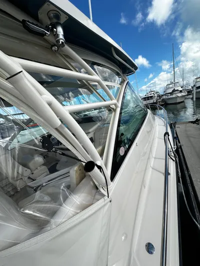  Yacht Photos Pics 2021 Grady-White Express 370 docked at marina under blue sky.