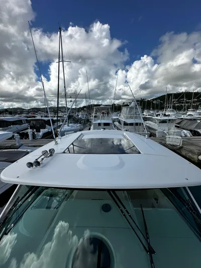  Yacht Photos Pics 2021 Grady-White Express 370 yacht docked under cloudy sky.