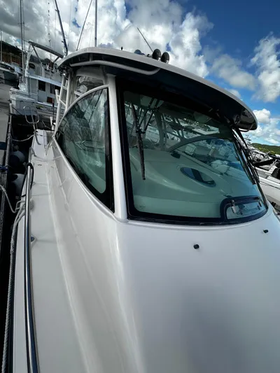 Yacht Photos Pics 2021 Grady-White Express 370 boat docked under cloudy sky.